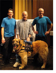 Don Eigler and his dog Neon (Argon was home that day) with Joel Harris (left) and Dan Foley at the Museum of Science in Boston. Dan and Joel are the stars of the <cite>Amazing Nano Brothers Juggling Show</cite>